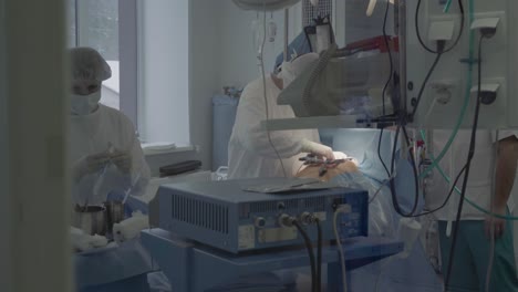 medical staff of the operating unit do heart surgery nurse assists in performing the operation