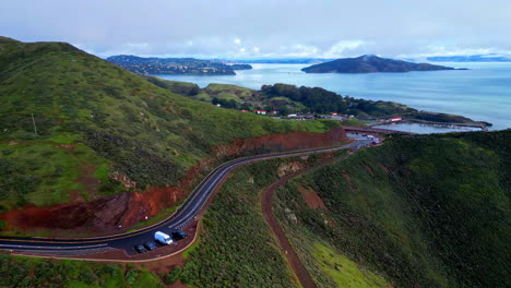 Aerial-drone-shot-over-Golden-Gate-Bridge-alongside-Golden-Gate-View-Point-in-San-Francisco,-California-on-a-cloudy-day