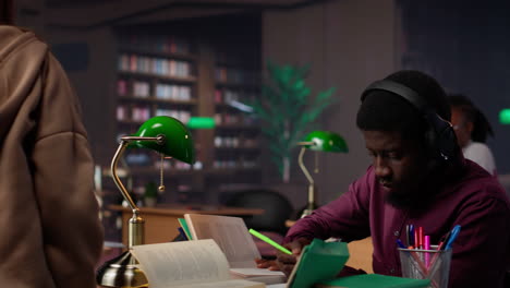 vertical video african american guy uses ambient focus music to help with school assignment