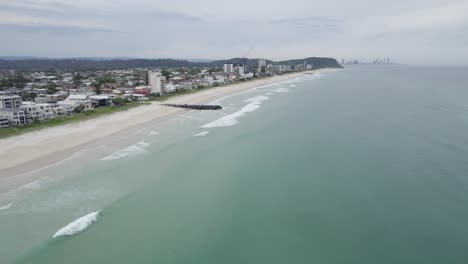 Coastal-Suburb-And-Ocean-In-Palm-Beach,-Gold-Coast,-Queensland,-Australia---aerial-drone-shot