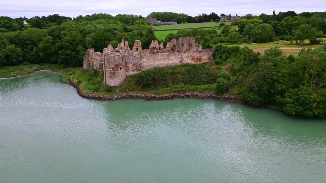 Smooth backward panorama drone movement from the Guildo Castle aka Château du Guildo at Arguenon, Saint-Jacut-de-la-Mer, Côtes-d'Armor, Brittany, France.