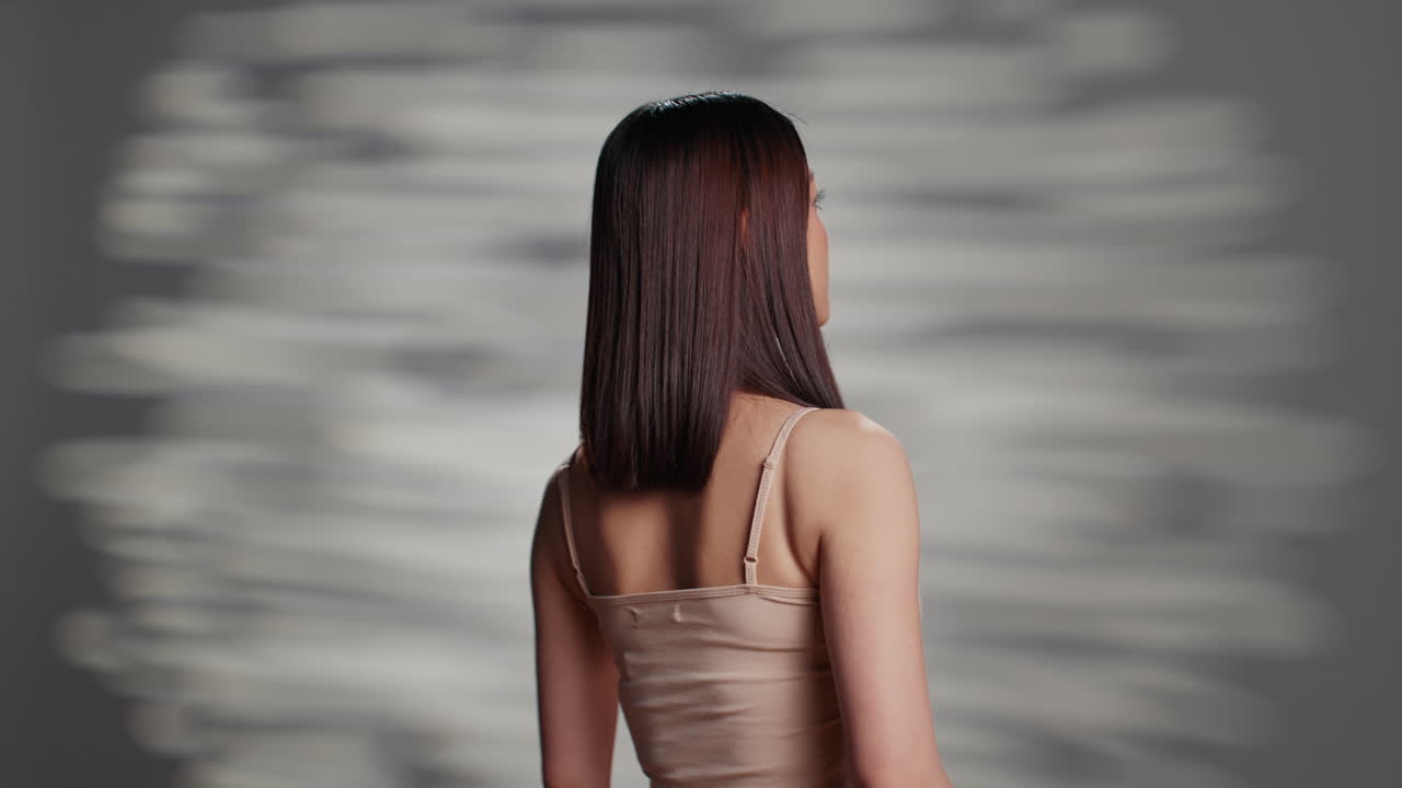 Woman performing facial massage for skin care