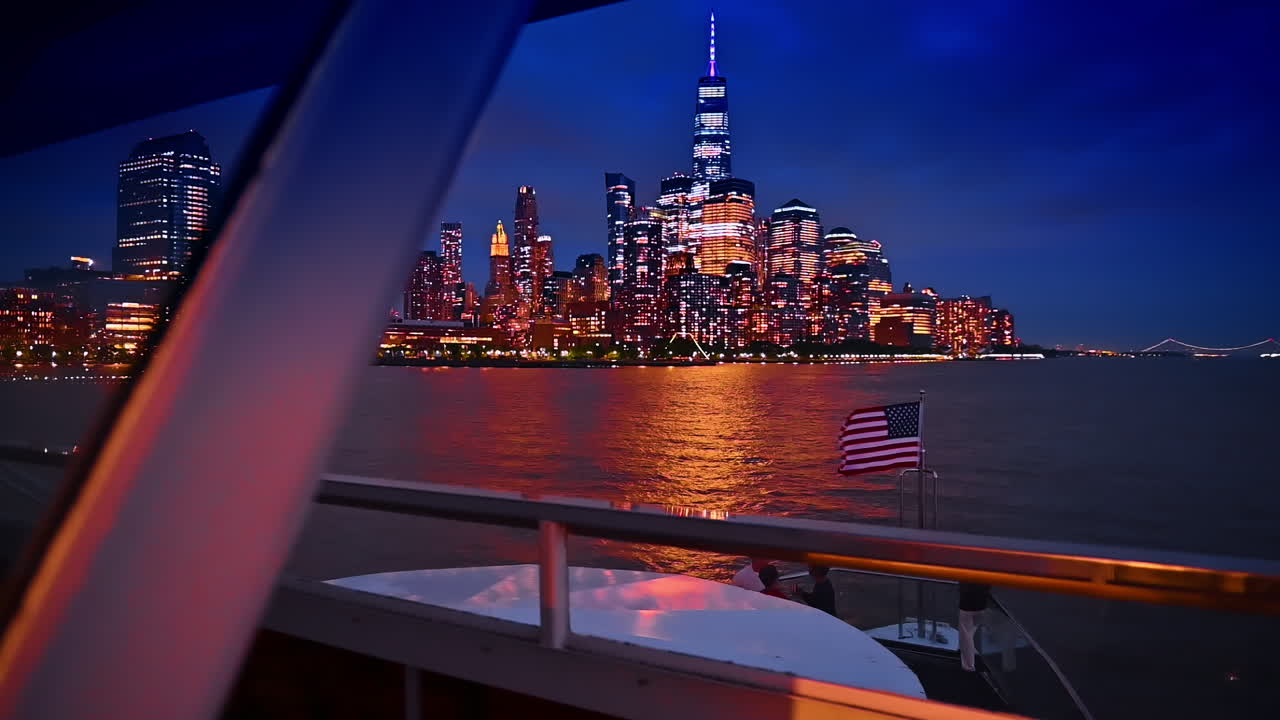 Spectacular skyline of modern New York at dusk time. View from the board of the riverboat travelling by the river