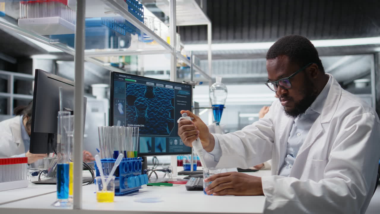 Vertical video Histology technician uses pipette to extract reagent from glass into test tube