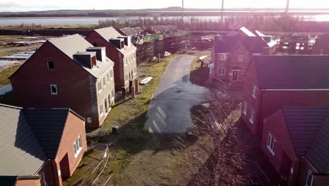 abandoned waterfront townhouse development construction site aerial view dolly right