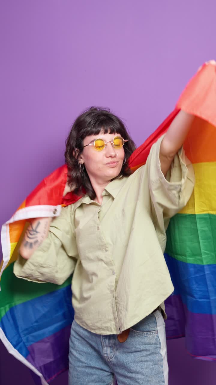 Woman with LGBTQ rainbow flag
