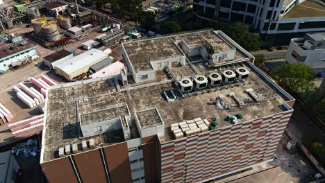 drone arc of rooftop of industrial building in yuen long industrial estate in hong kong