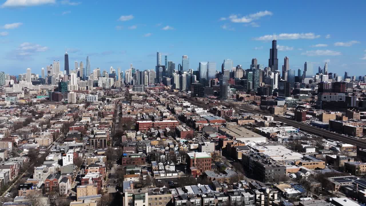 Forward Drone Shot Above West Side Chicago Neighborhood. Skyline in Background