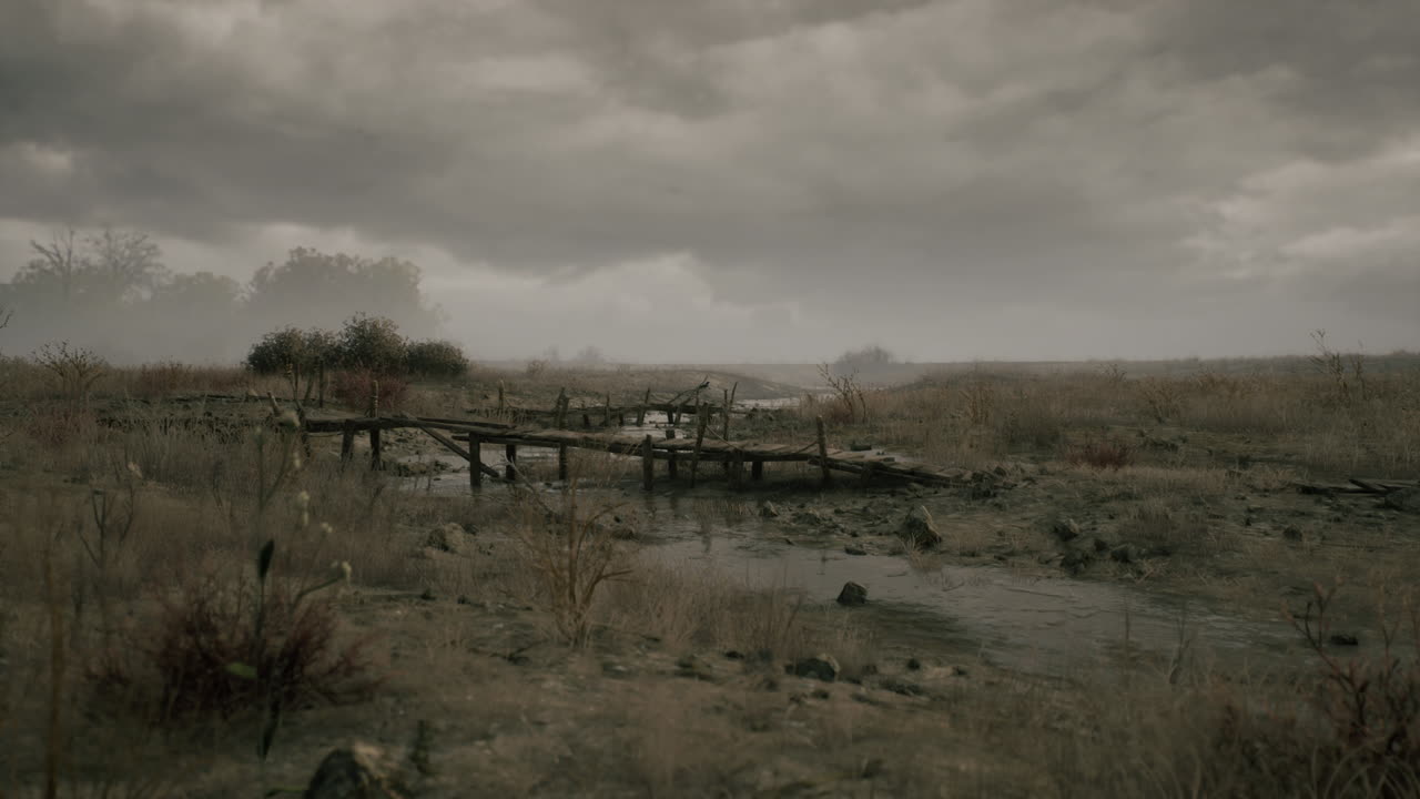 Dried landscape with a wooden bridge under a cloudy sky during twilight