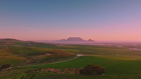 aerial shot of the landscape and diverse terrain of the western cape of south africa, overseeing the stunning outline of table mountain