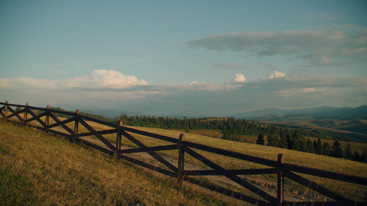 Scenic Mountain Meadow with Fence