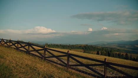 scenic mountain meadow with fence
