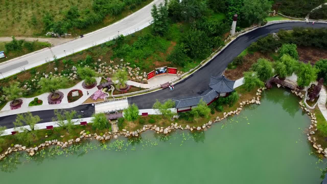 Complete 360 loopable aerial panoramic view over Huaxiacheng park with beautiful traditional buildings in Weihai city, China