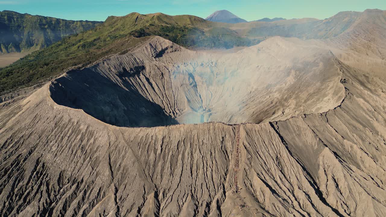 bird eye view of the Bromo Volcano's crater with smoke in the air - Bromo Moutain, East Java - Indonesia