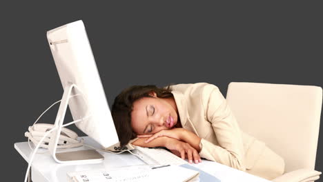 businesswoman sleeping on her desk