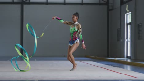 female gymnast performing at sports hall