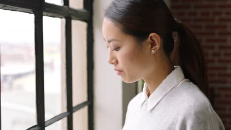 woman looking out the window