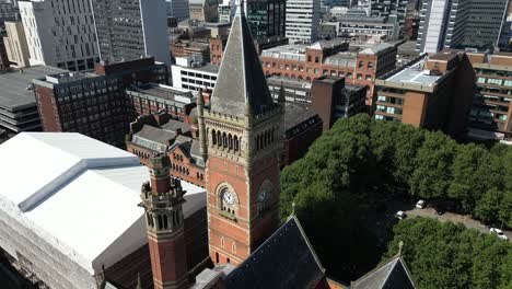 aerial drone flight circling around the rooftop clocktower of manchester crown court on minshull street