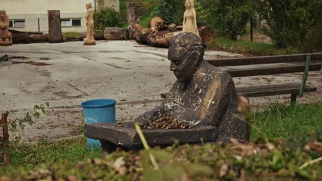 outdoor garden statue of josip broz tito seated in kumrovec, croatia