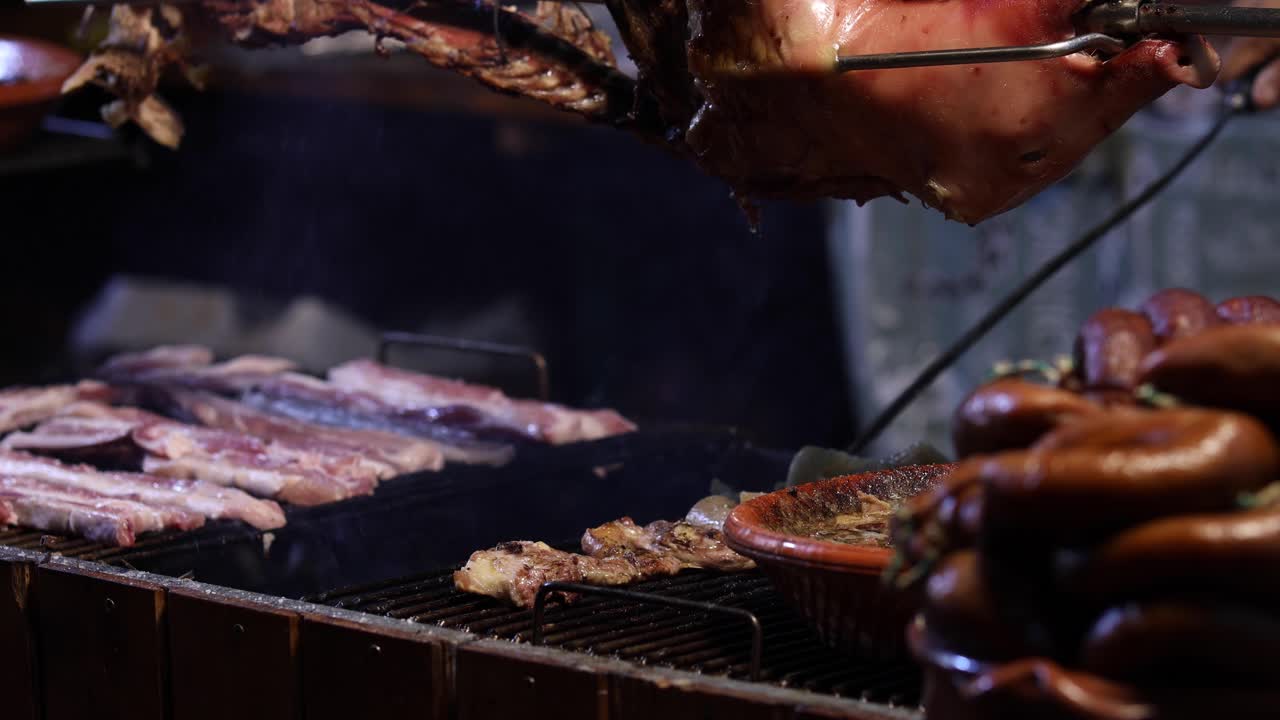 Street Food. Pork being cooked over a hot charcoal fire