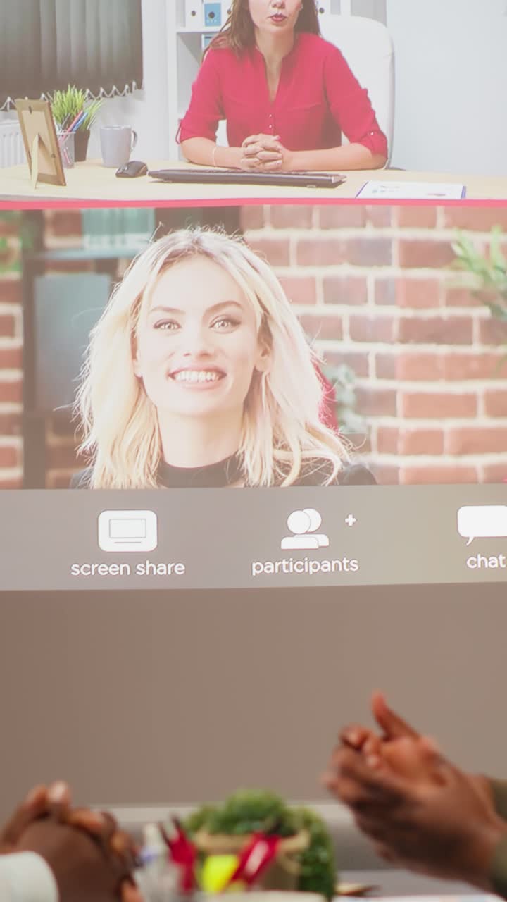 Vertical Video Diverse coworkers joining a video conference with international stakeholders