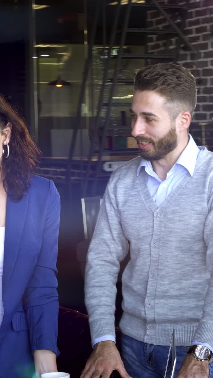 Couple Walking In A Cafe