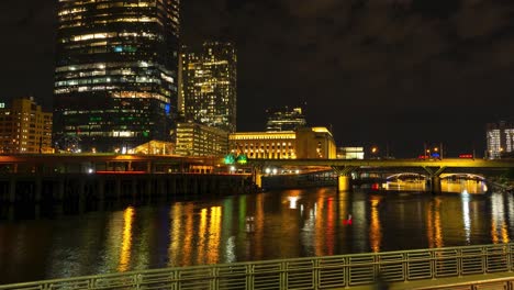 night timelapse colorful city lights with river and people walking philadelphia