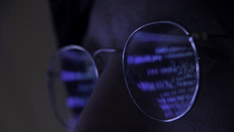 close up of programmer hacker working on computer