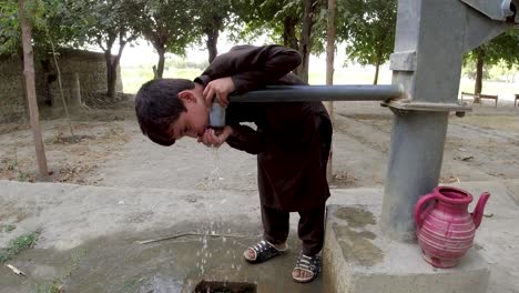 a child's sip from the hand pump