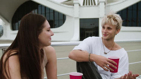 young friends talking outdoors