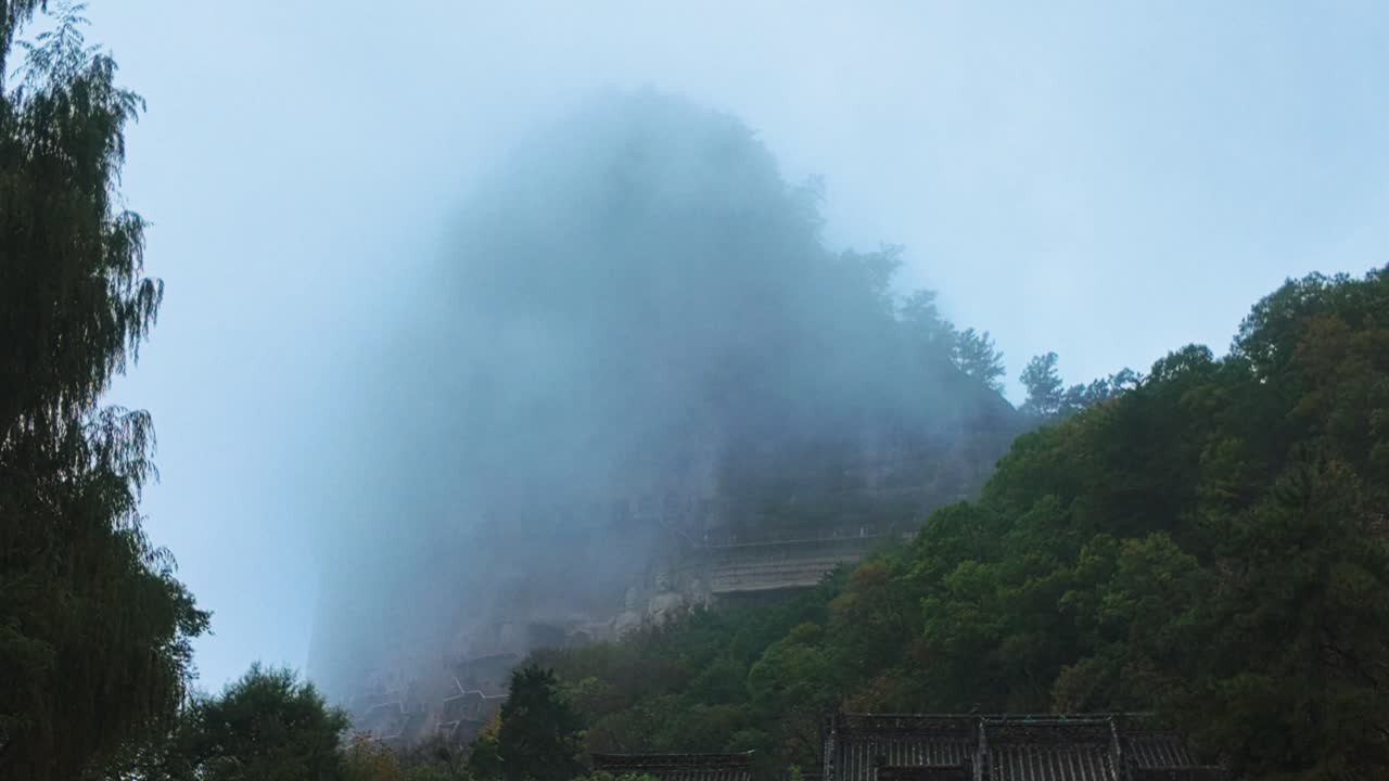 Foggy Clouds At Tianshui Maiji Mountains In Gansu Province, China. Wide Shot