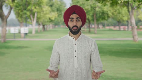 confused sikh indian asking what question in park