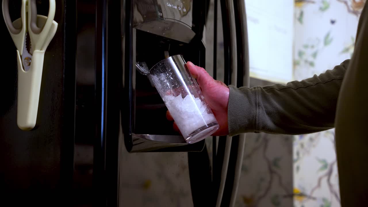 Ice dispenser operation, modern kitchen appliances, drink convenience