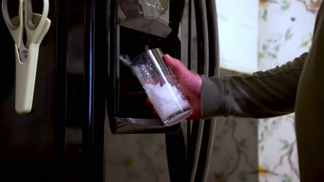 ice dispenser operation, modern kitchen appliances, drink convenience