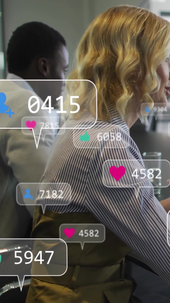 Vertical video: Alerts popping, woman and coworker working while bubbles growing, showing metrics