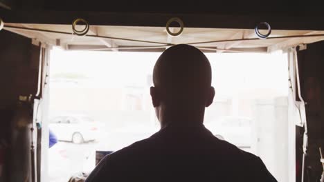 african man repairing car