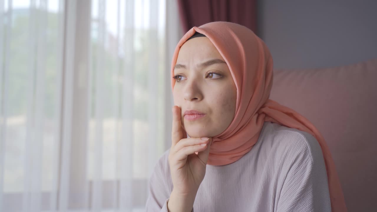 Unhappy Muslim Woman In Hijab. Free Stock Video Footage Download Clips