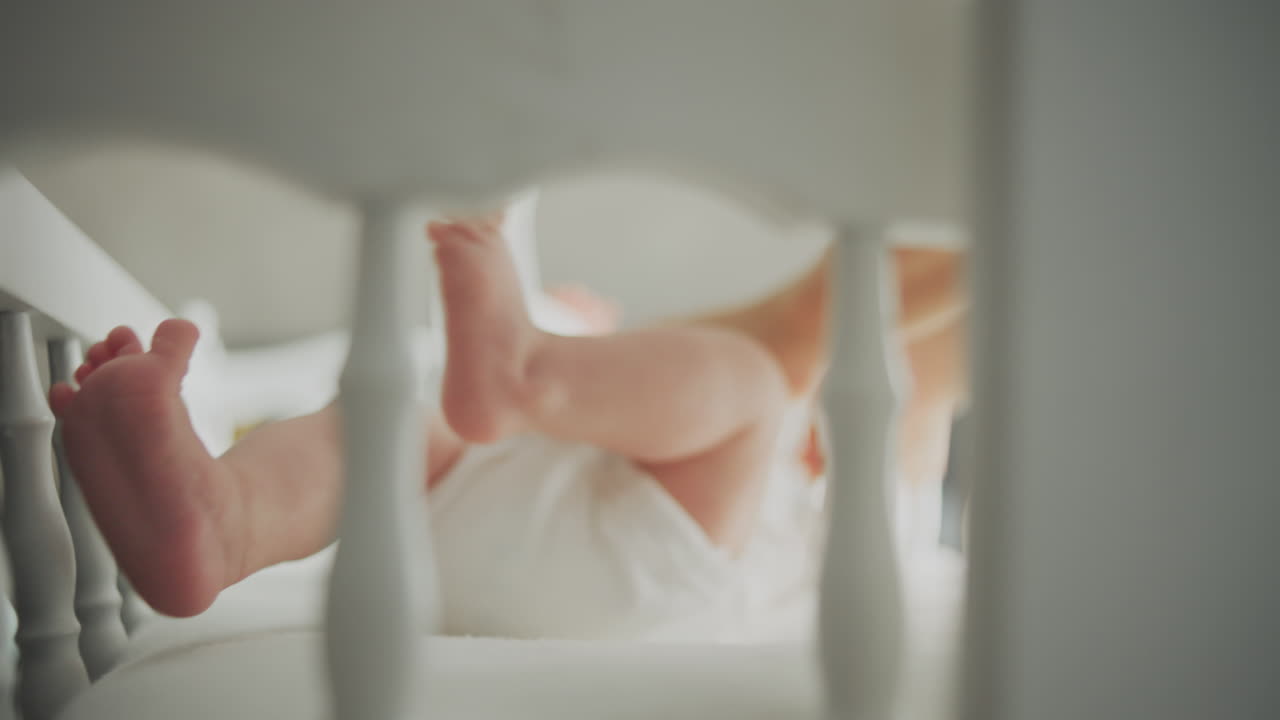 Baby Feet in a Crib