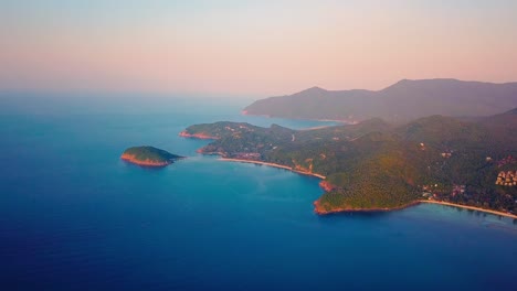 4k-Aerial-Drone-Push-Forward-Shot-of-Salad-Beach-on-Koh-Phangan-in-Thailand-with-Fishing-Boats,-Teal-Water,-Coral,-and-Green-Jungles