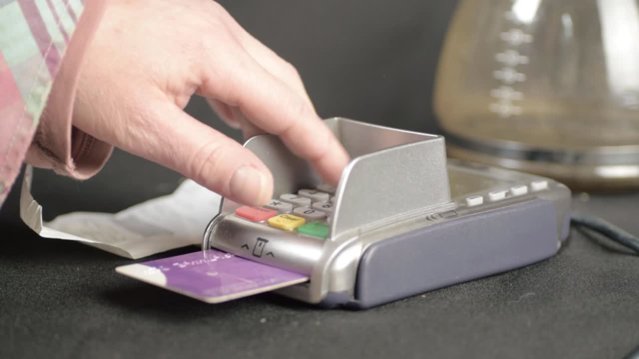 Hand checking receipt before paying for goods by card medium shot