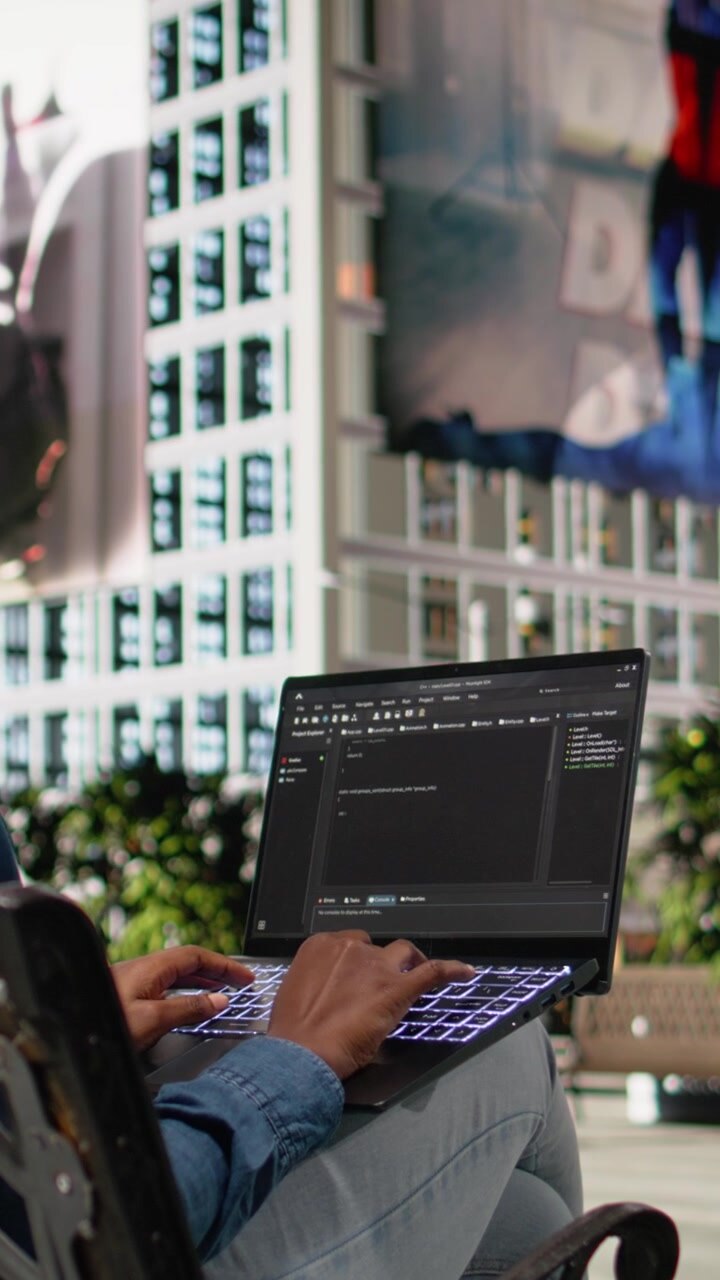 Vertical Video Writing code on laptop, implementing programming language, software developer