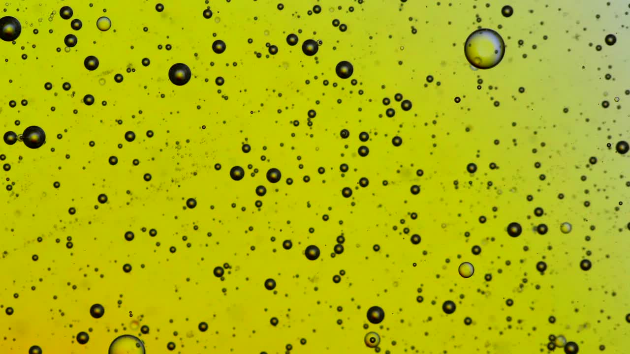 pequeños círculos de colores que se mueven sobre un cambio de color de fondo