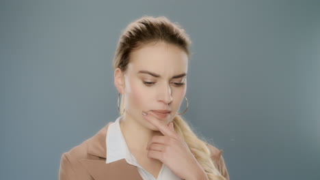 Thoughtful-woman-in-studio