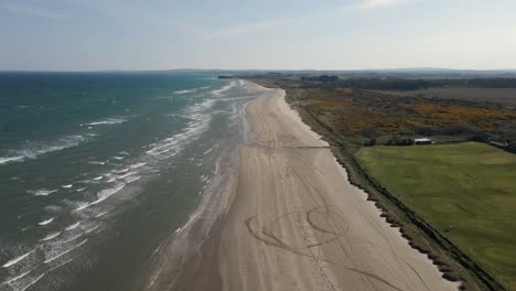 drone shot of a sunny beach in meath, ireland