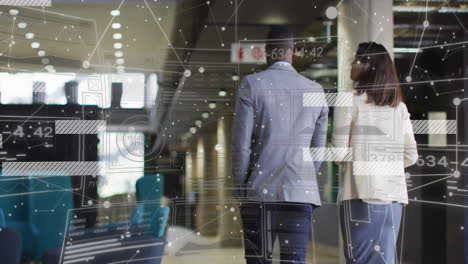 animation of data processing over diverse male and female business colleague walking in office
