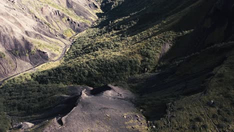 Aerial-thorsmörk-grassy-forest-mountains,-famous-icelandic-national-park-landmark-landscape-November