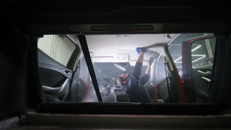 professional car cleaning. сar wash. interior detailing. dry clean and detail a car interior. deep seats cleaning. wiping foam in car wash. cleaning the car panel from dust. a vacuum cleaner
