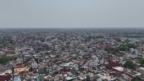 high-angle view capturing the tightly packed housing and bustling streets of varanasi, where every corner tells a story.