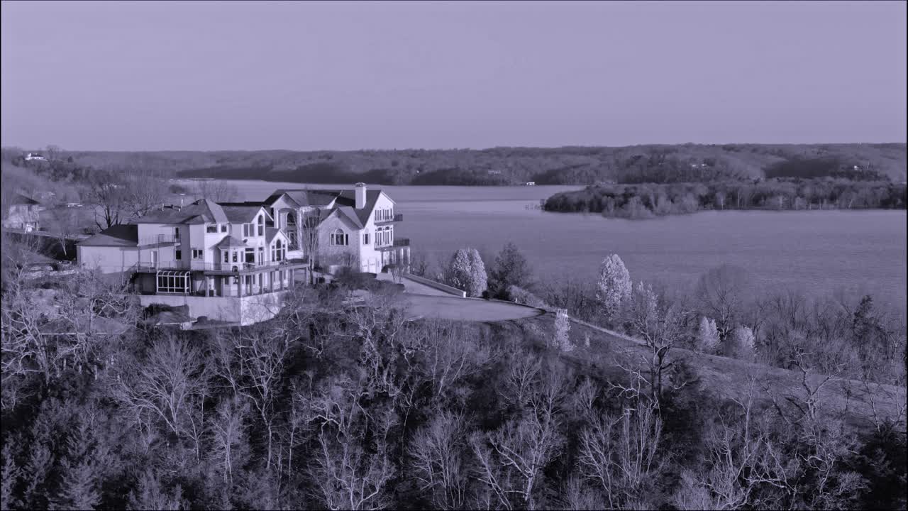 Cinegraphic color cast of executive homes by the lake