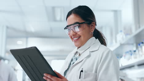 Science,-tablet-and-woman-smile-in-a-laboratory